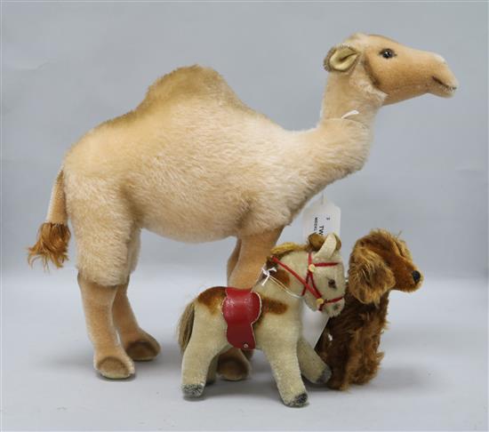 A Steiff camel, a Steiff 1960s miniature pony and an Irish Setter, all with button in ear